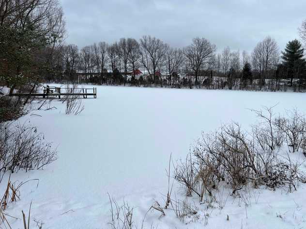 Frozen lake with snow on top